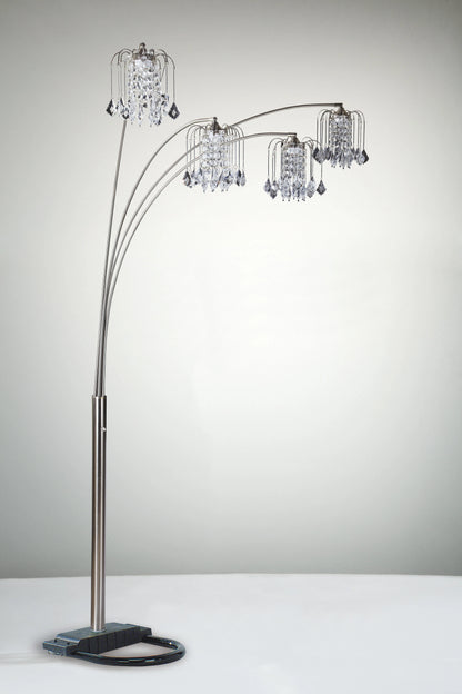 Arc floor lamp with crystal-like shades on a neutral background