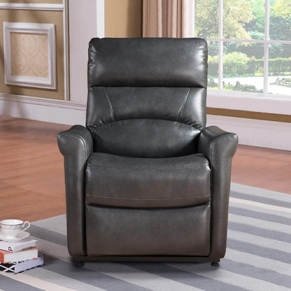 Black faux leather recliner chair in a living room setting with books and a cup on a small table.
