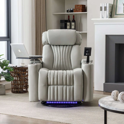 Gray recliner chair in a living room setting with a laptop on a small table.