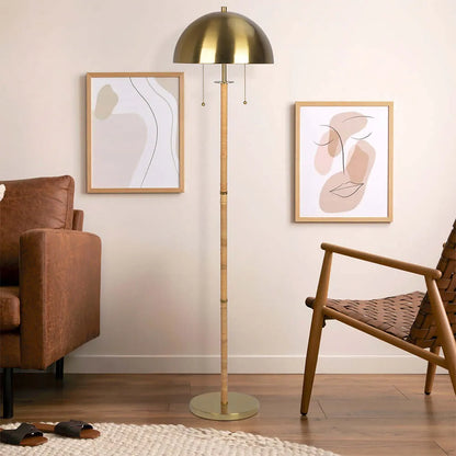 Brass floor lamp in a living room with abstract art on the wall
