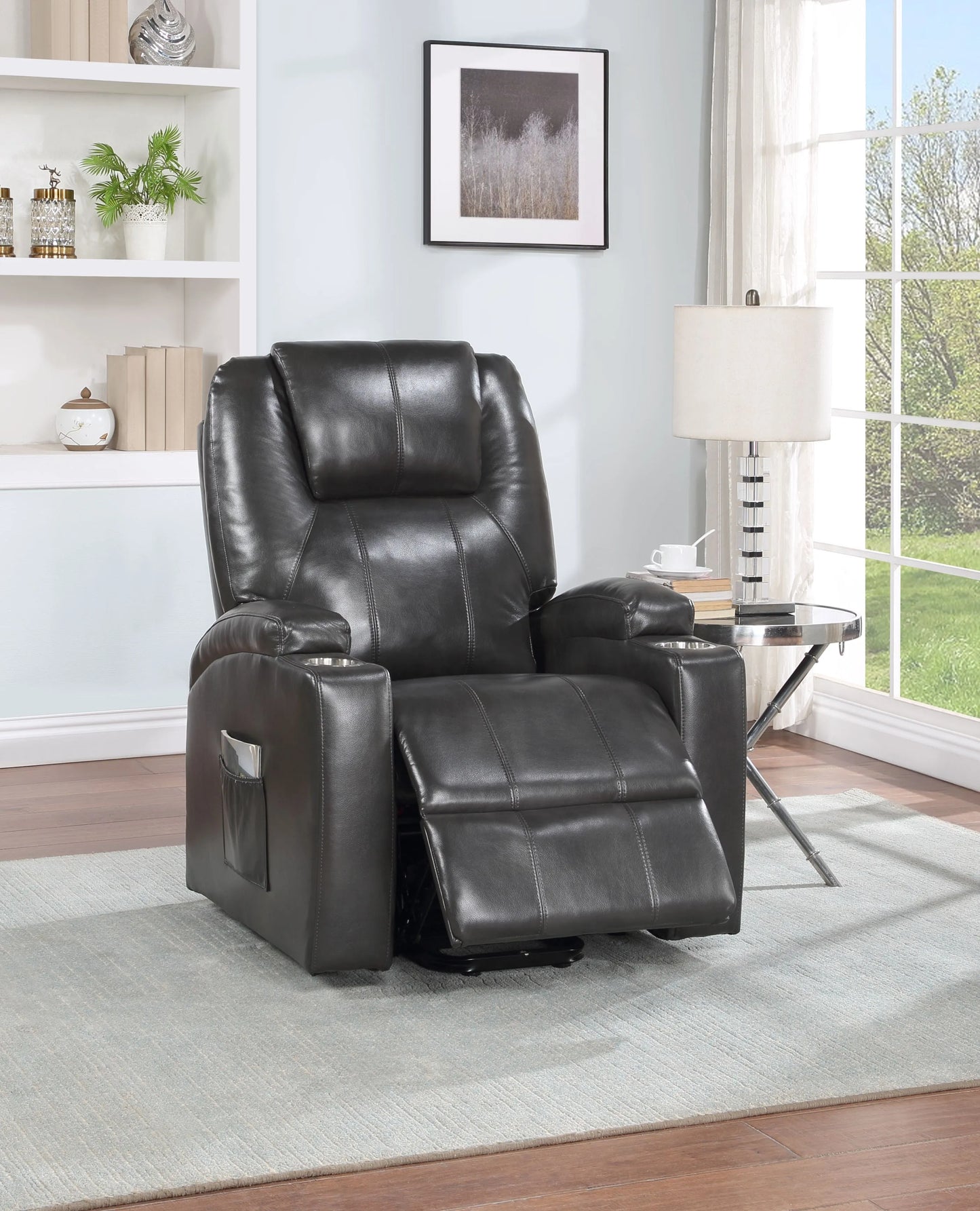 Black leather recliner chair in a living room setting with a bookshelf and window in the background.
