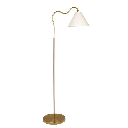 Floor lamp with brass base and white shade on a white background