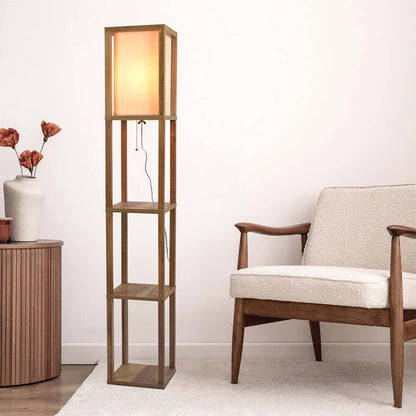Wooden floor lamp with shelves next to a chair and side table in a room.