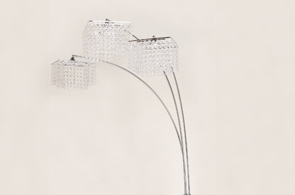 Crystal floor lamp with three lampshades on a beige background