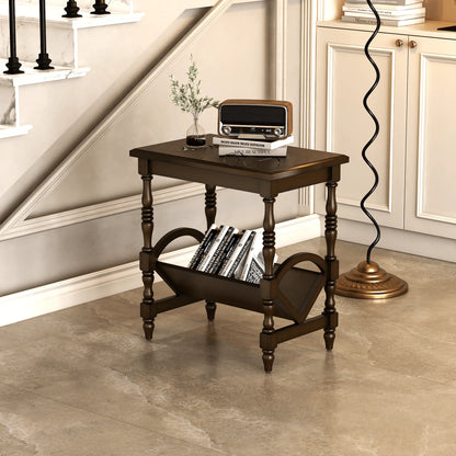 Wooden end table with books and a plant in a room with a staircase.
