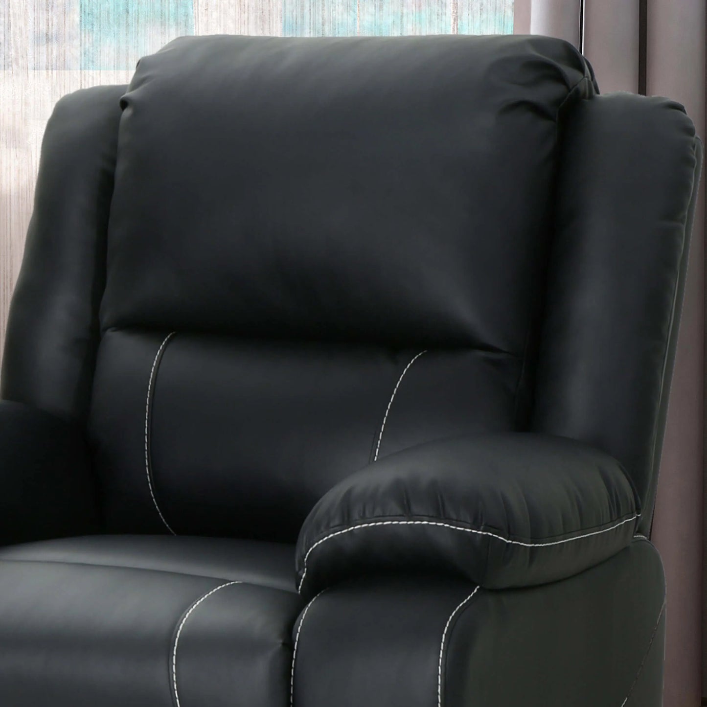 Close up of Modern Faux Leather Manual Swivel Recliner chair cushions with detailed stitching on a blurry background. 