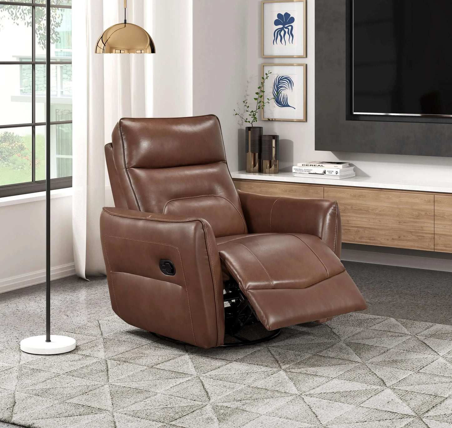 Brown leather recliner chair in a living room setting with a TV and decor.