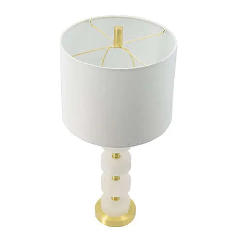 White table lamp with marble accents and gold base on a white background