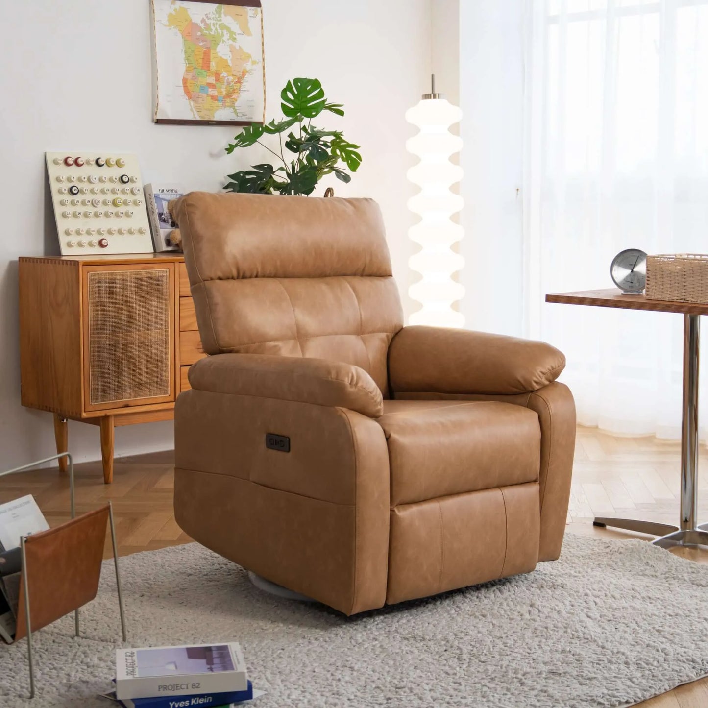 Brown recliner chair in a living room setting with decor elements.