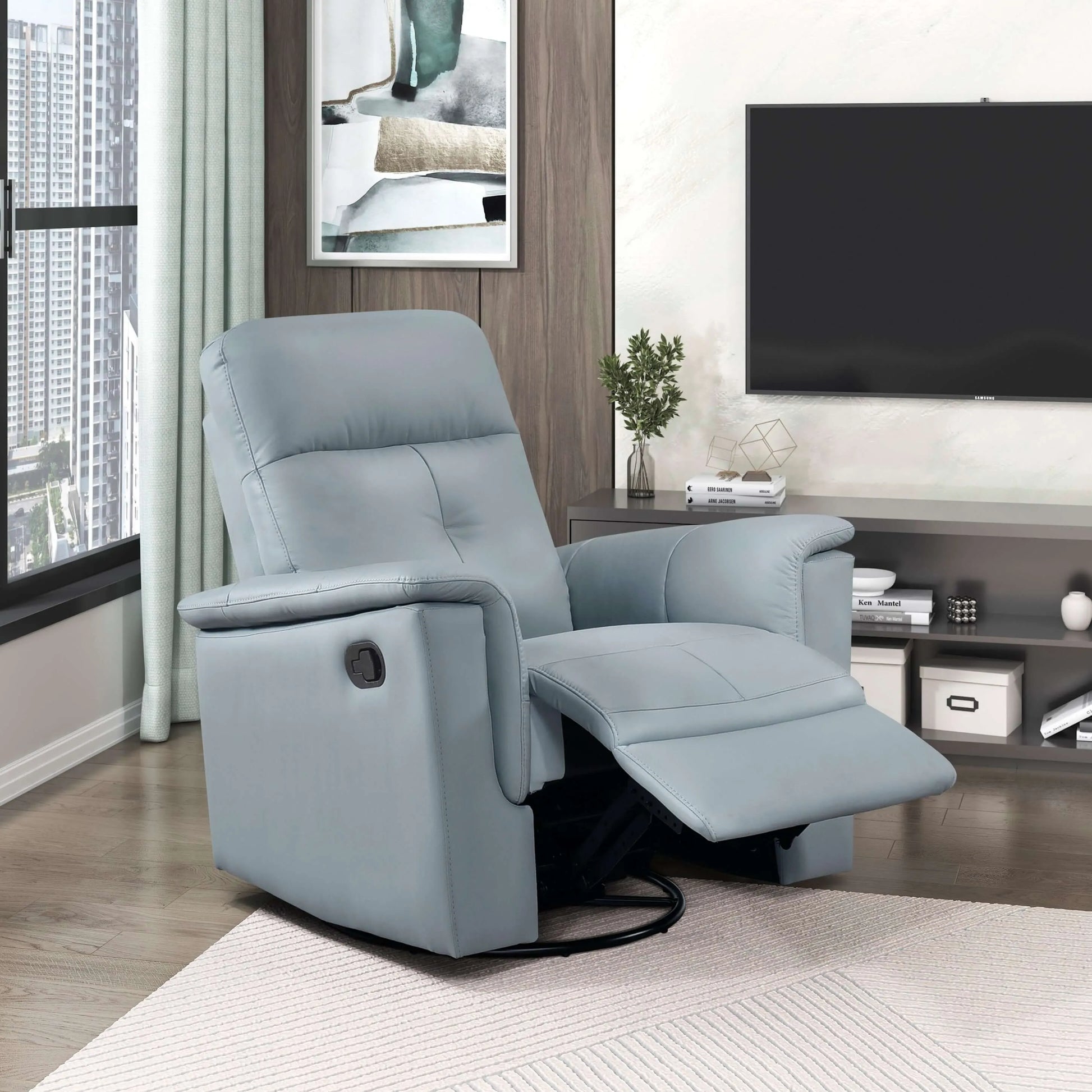 Blue recliner chair in a living room setting with a television and decor.