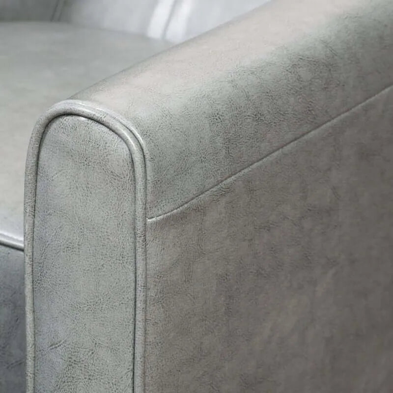Close-up of a textured gray recliner chair armrest