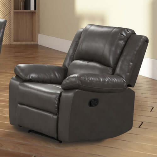 Gray faux leather recliner chair on a wooden floor with a neutral wall background