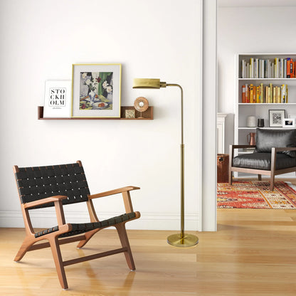 Modern living room with a wooden chair, floor lamp, and bookshelf.