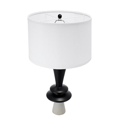 Table lamp with white shade and black base on a white background