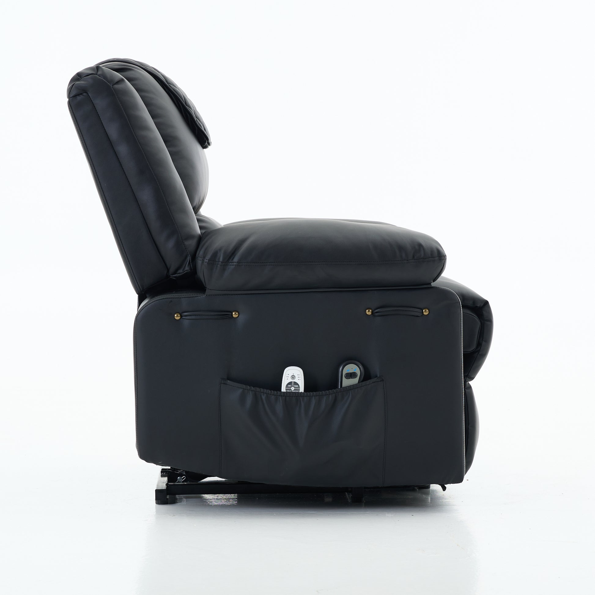 Side view of a black recliner chair with storage pocket and remote controls on a white background