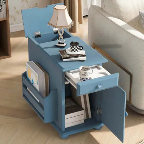 Blue side table with lamp, books, and a lampshade in a living room setting.