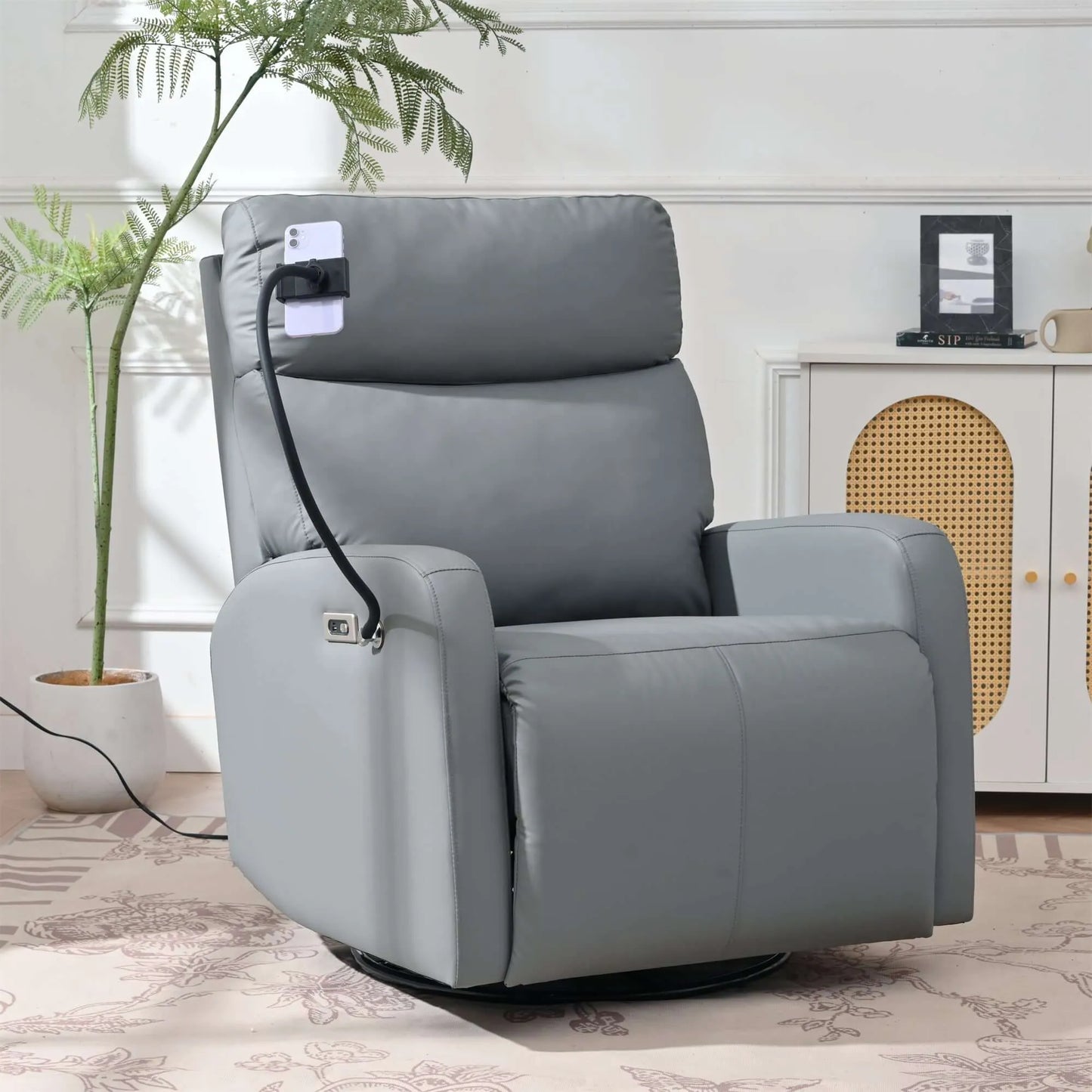 Gray recliner chair with power outlet attachment in a room setting.