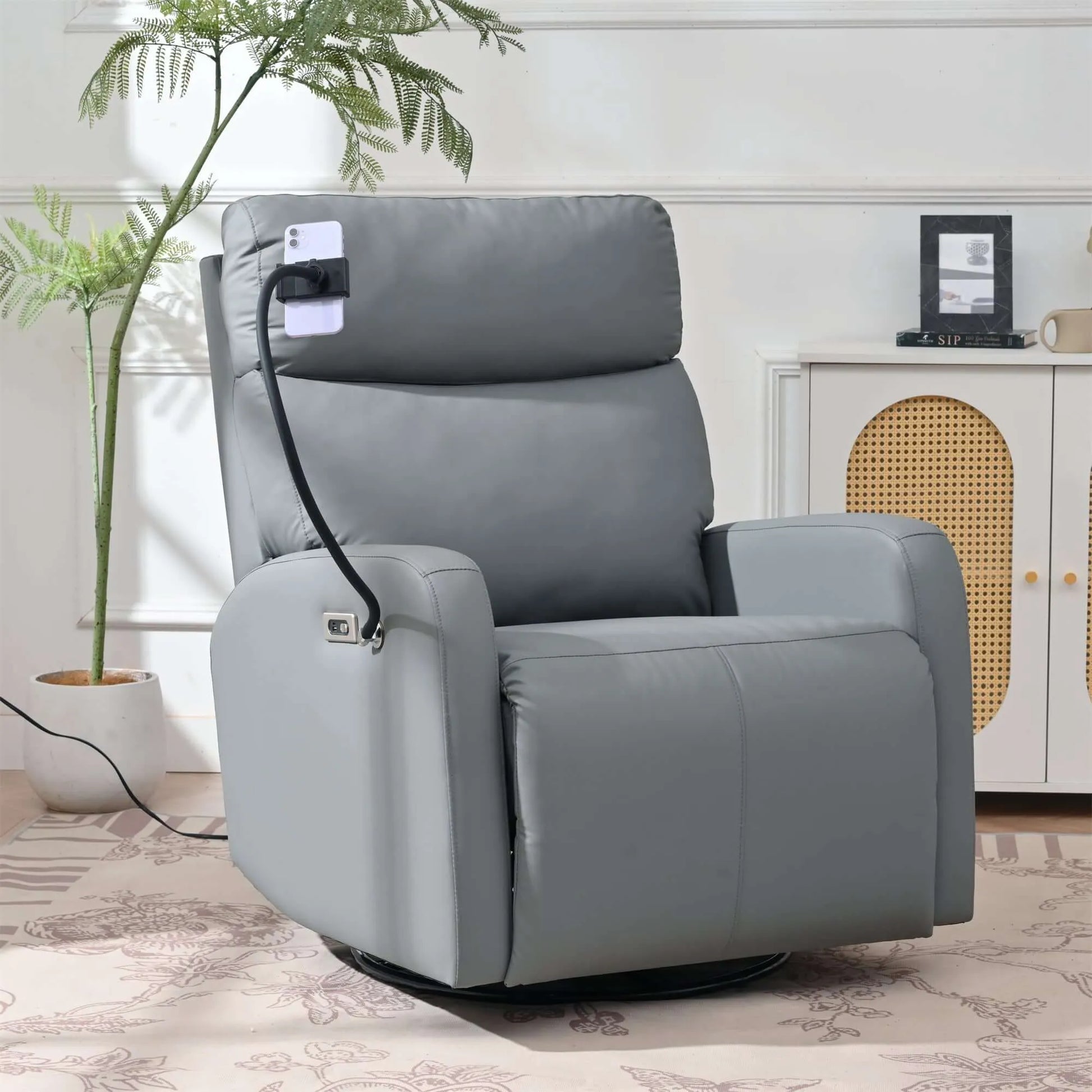 Gray recliner chair with power outlet attachment in a room setting.