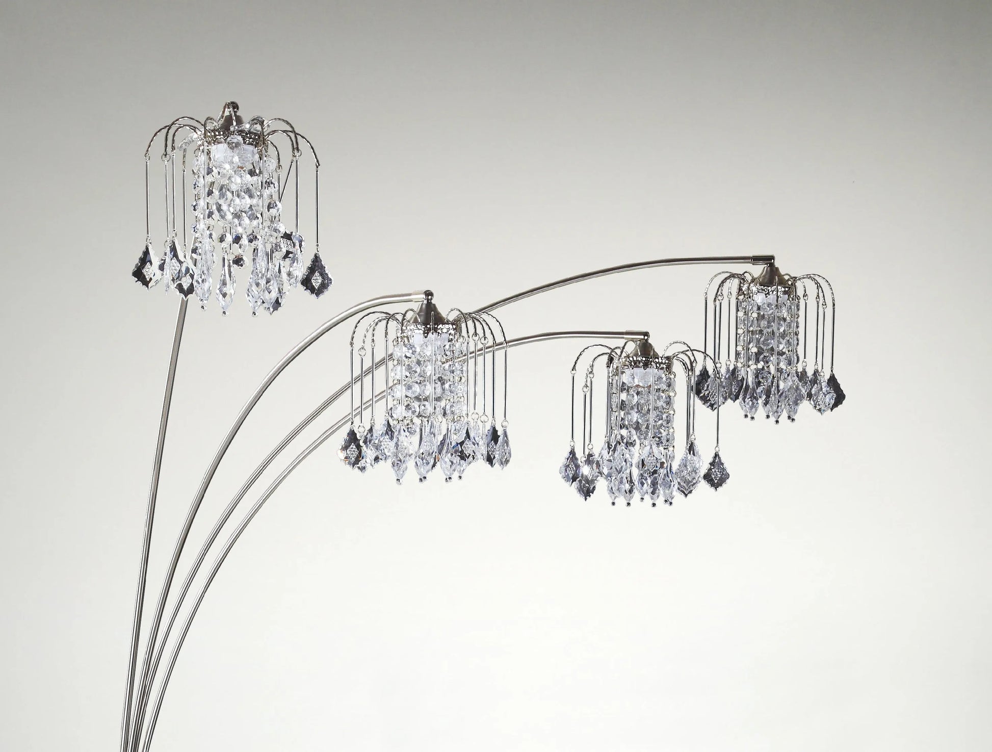 Chandelier style floor lamp with multiple crystal lights on a gray background