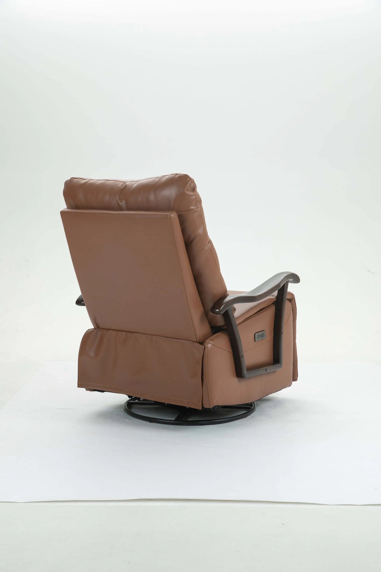 Angled back view of a brown leather recliner chair on a white background