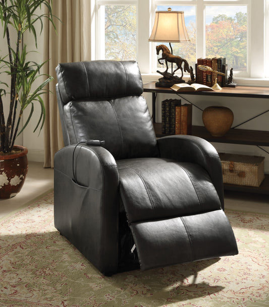 Dark brown leather recliner chair in a room with a desk and window