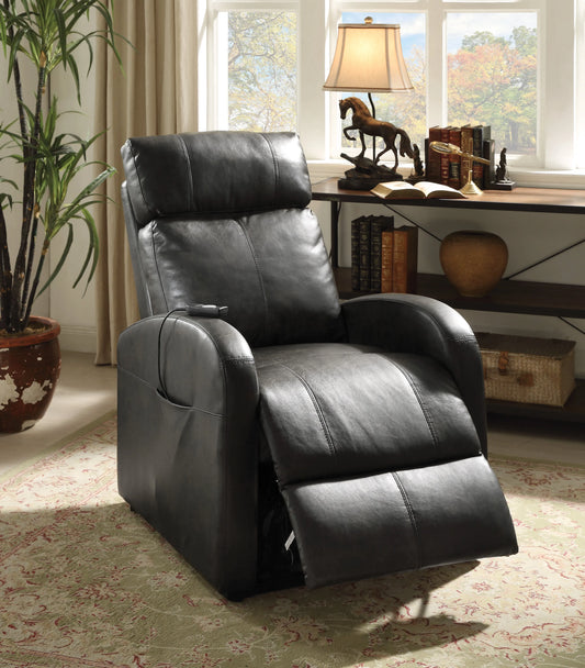 Dark brown leather recliner chair in a room with a desk and window