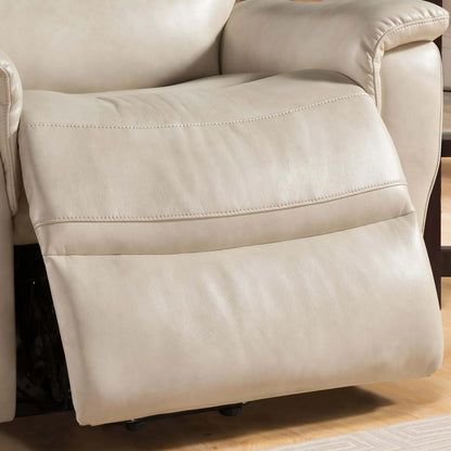Close up of a cream color reclilner chair footrest on a wooden floor