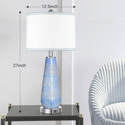 Table lamp with blue decorative base and white shade on a table next to a chair, with measurements indicated.