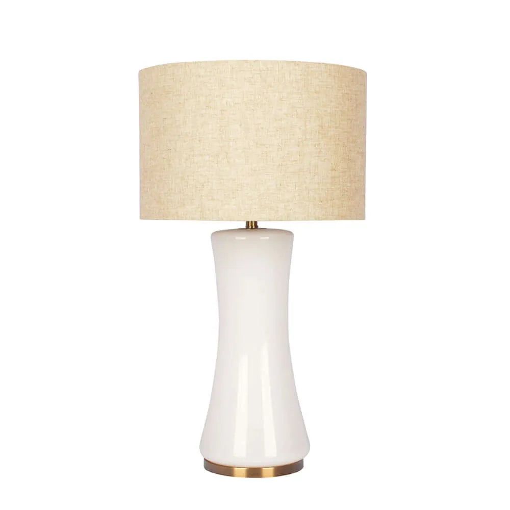 Table lamp with a beige lampshade and white base on a white background