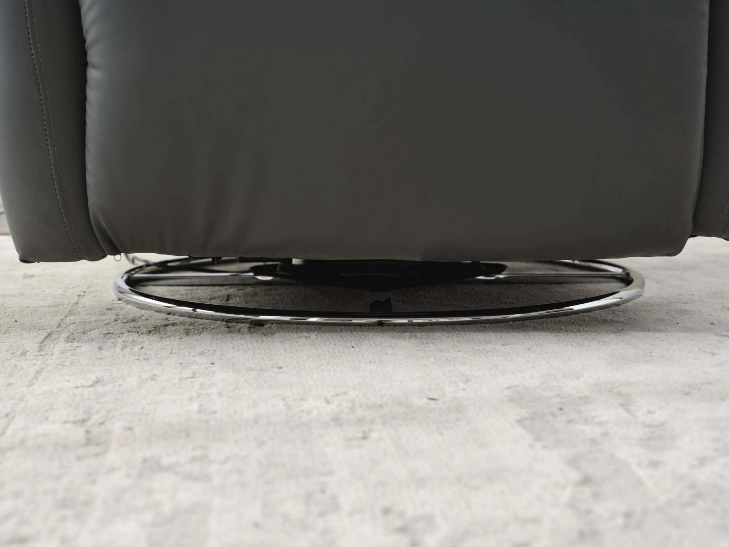 Close up of metal base on the Power Swivel Glider Recliner-Dark Gray