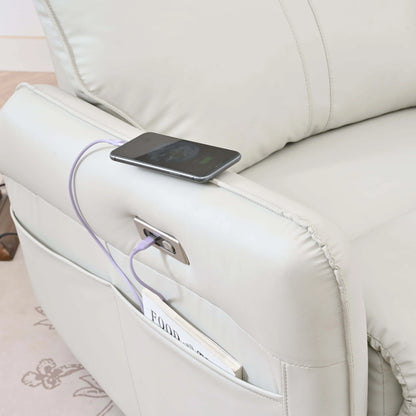 Phone charging from a power bank on a light gray recliner chair