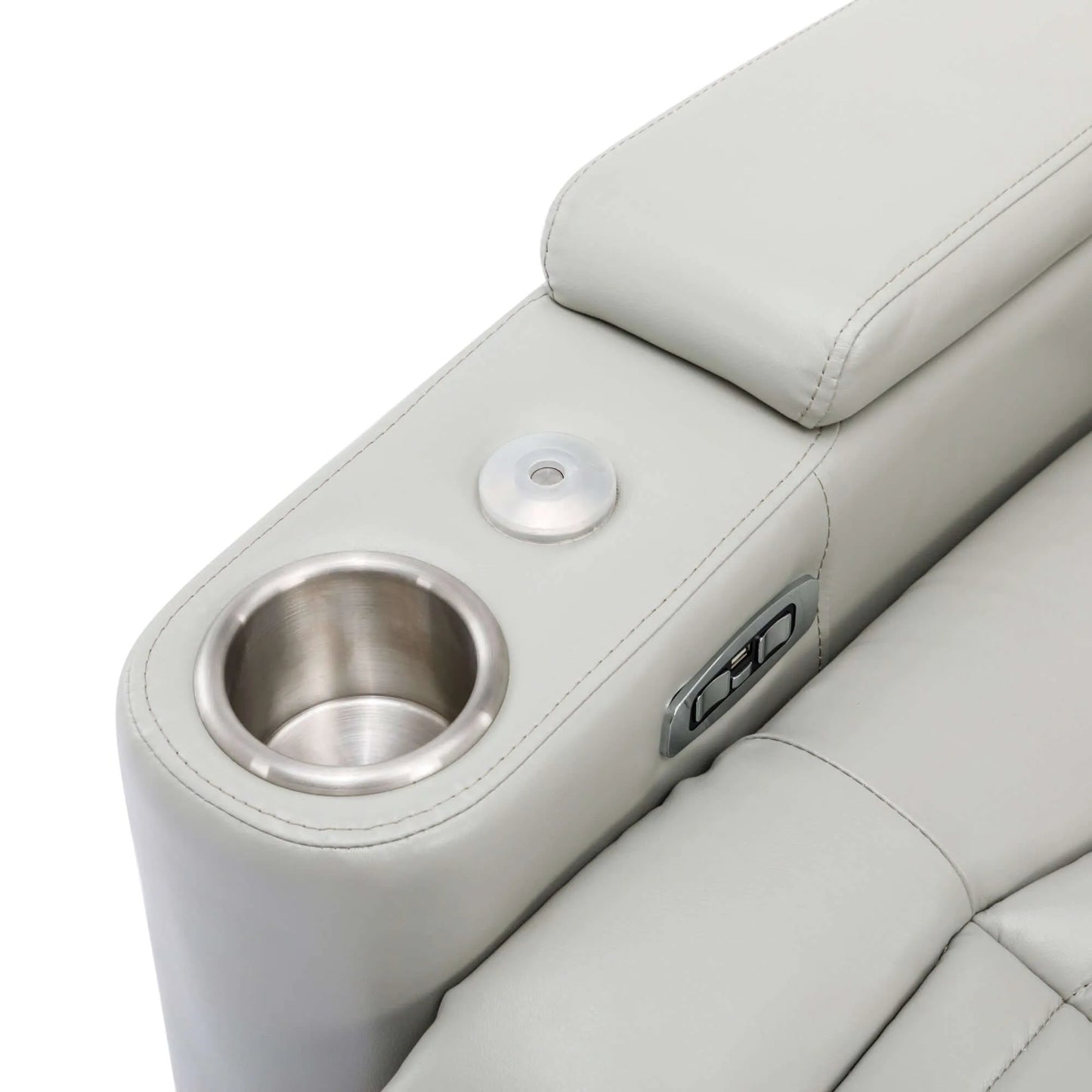 Close-up of a light gray recliner chair armrest with cup holder and USB port.