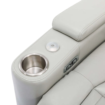 Close-up of a light gray recliner chair armrest with cup holder and USB port.