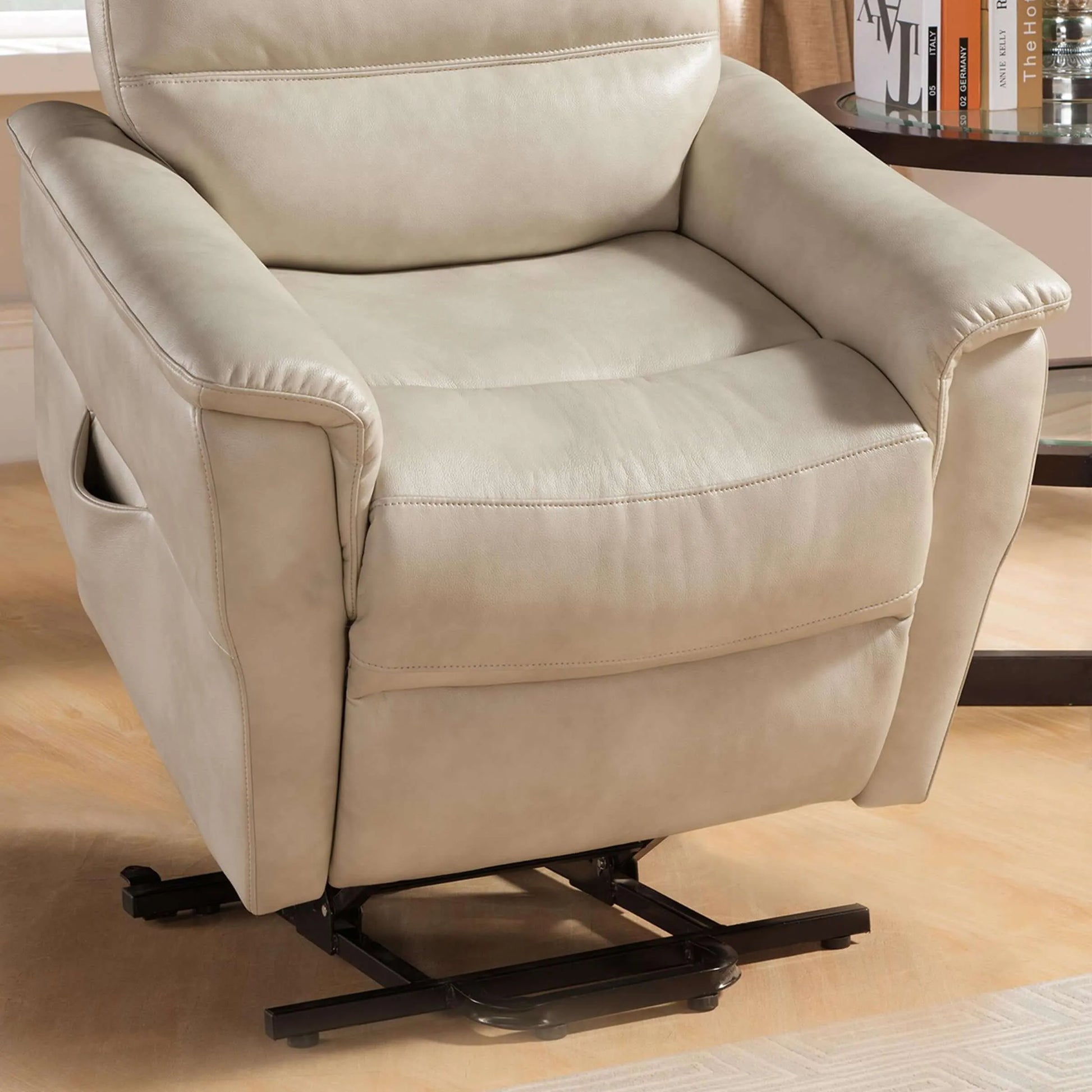 Cream color recliner chair in a lift position in a living room setting