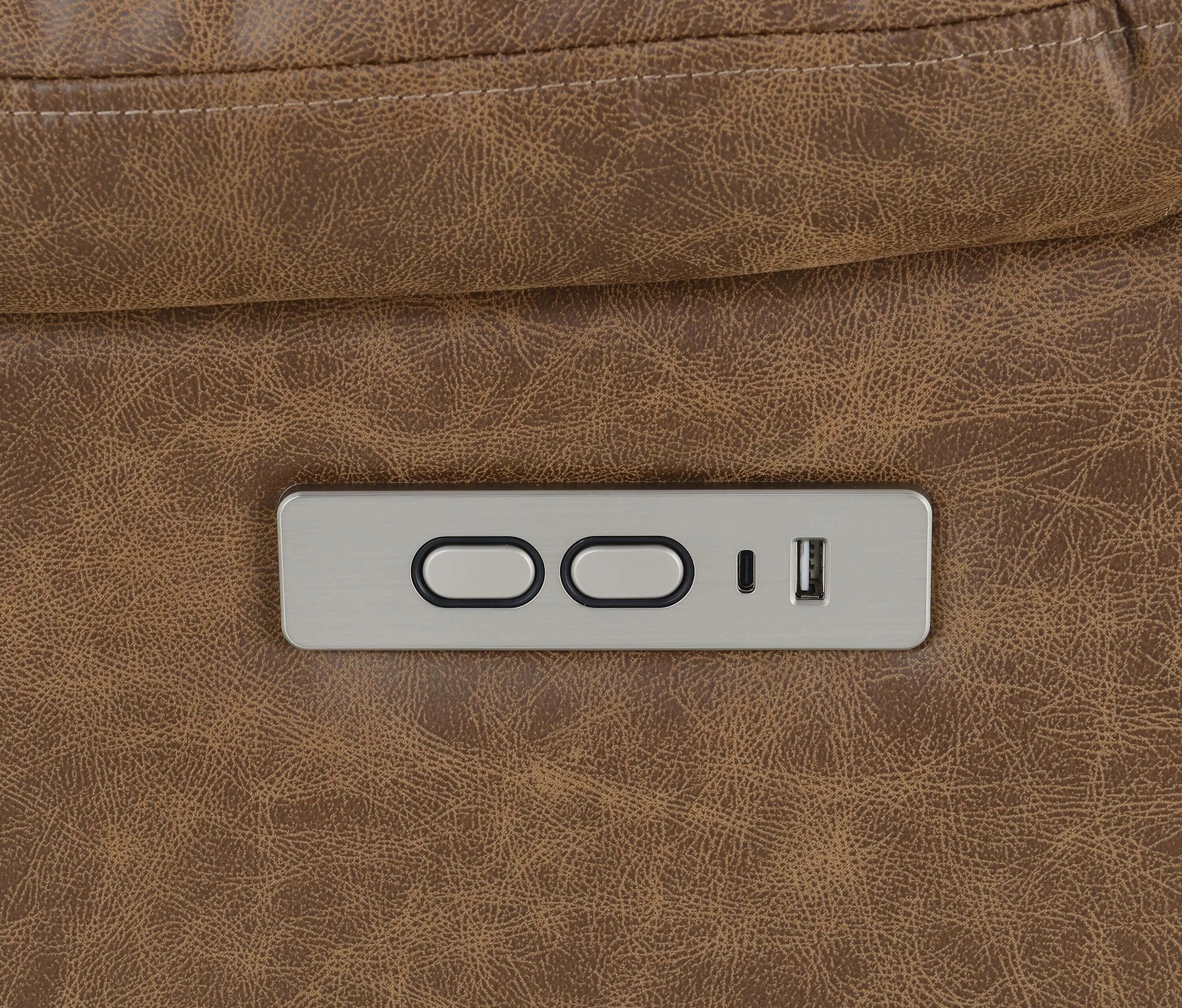 Close-up of recliner chair controls and usb port on a brown leather background.