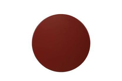 Top of round wooden end table on a white background