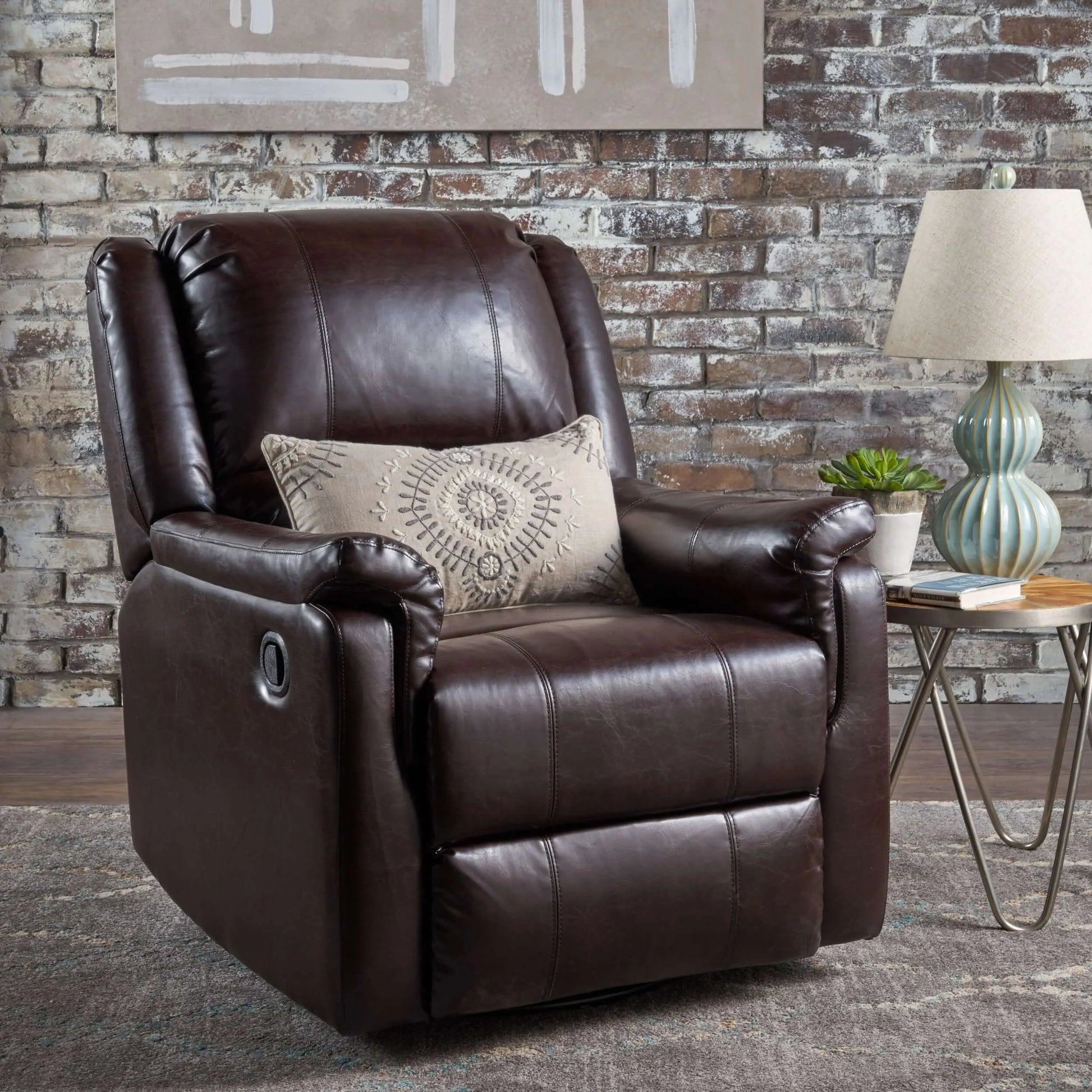 Brown faux leather recliner chair with a decorative pillow in a living room setting.