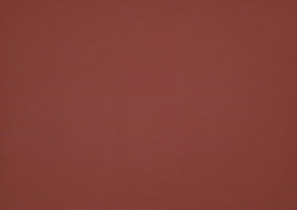 Solid red leather swatch with a textured pattern