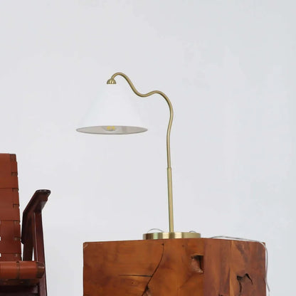 Gold lamp on a wooden surface with a white background